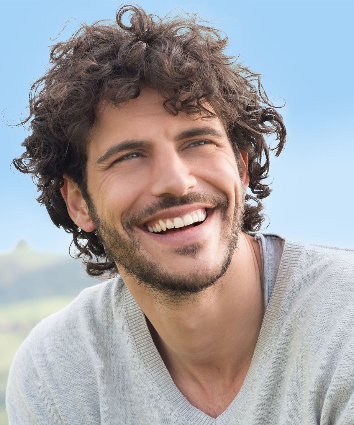 Smiling man outdoors, relaxed and at ease